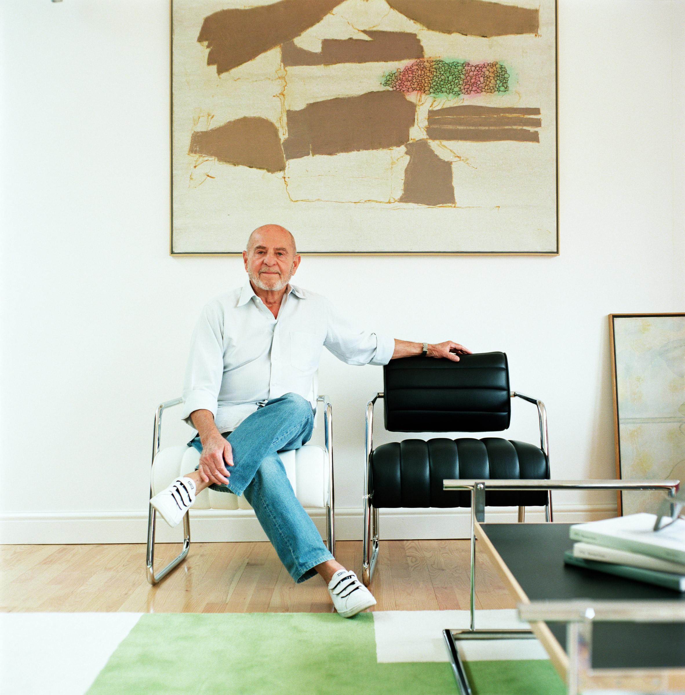 Zeev Aram photographed in his home