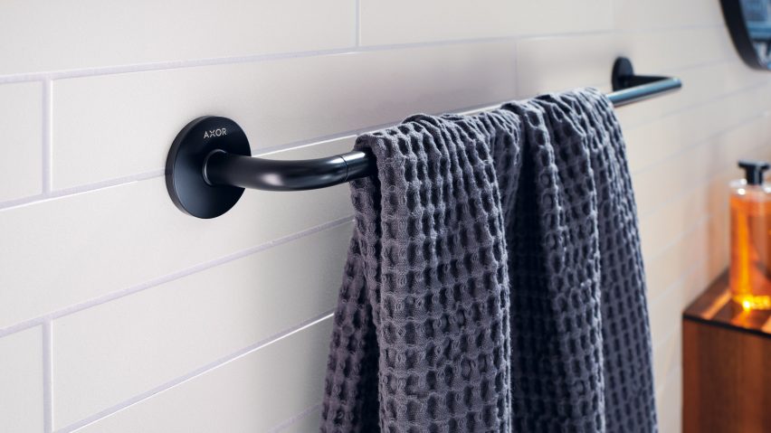 A black towel rail by Axor with a blue towel