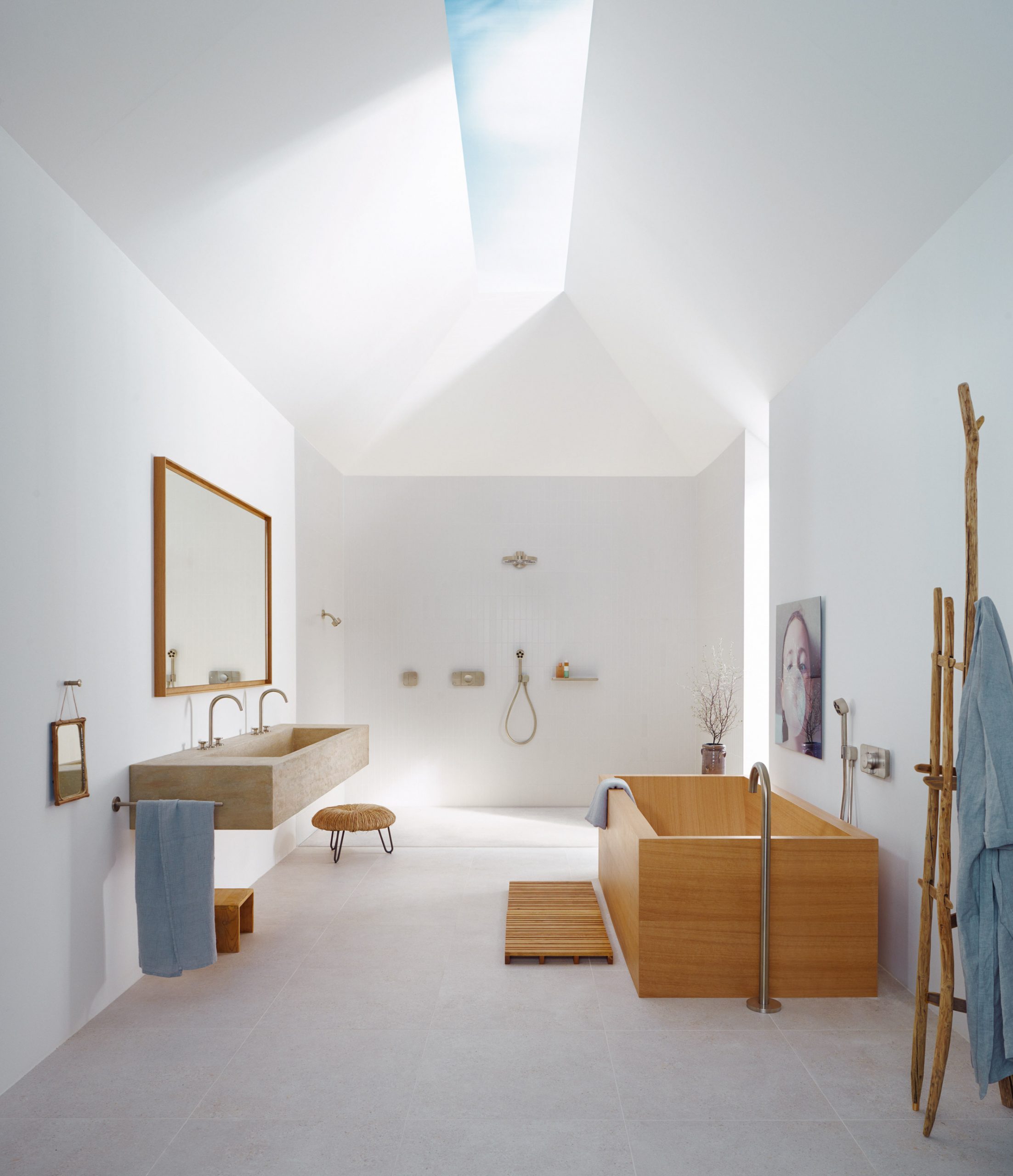 A white bathroom with wooden detailing