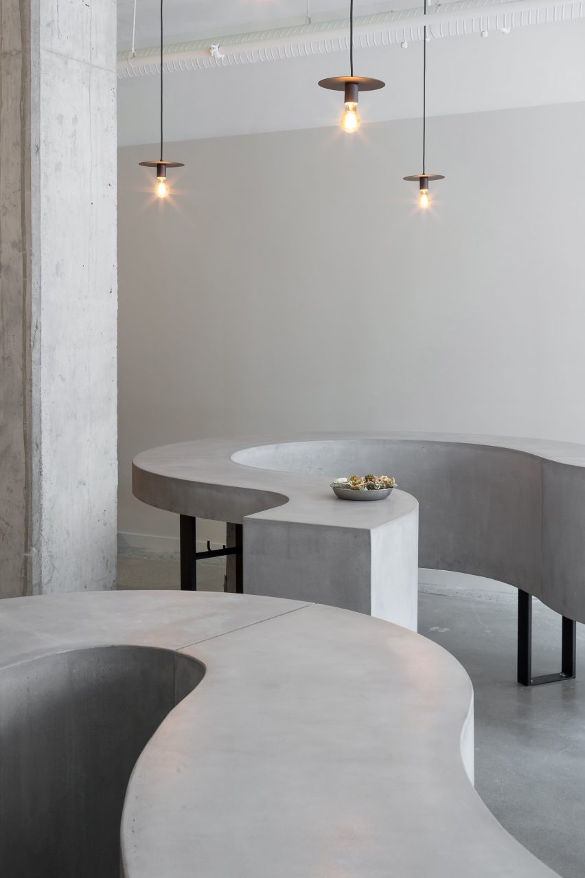 Pendant lamps and concrete tables in ShuckShuck