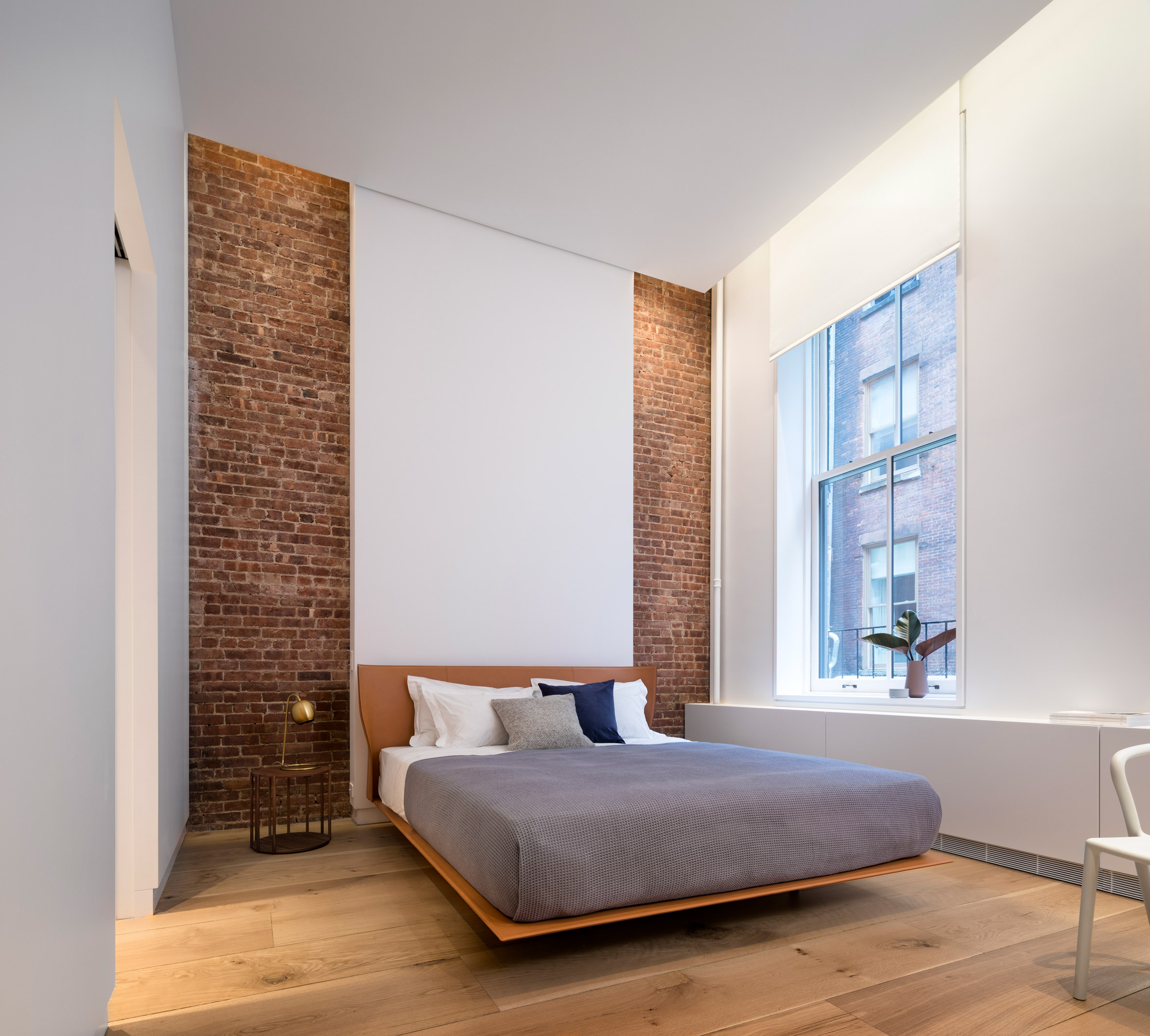BC—OA incorporated brick party walls into the space