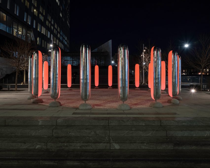 The pillars are two-tone, with reflective silver on the outside and translucent white insides fitted with LED lights