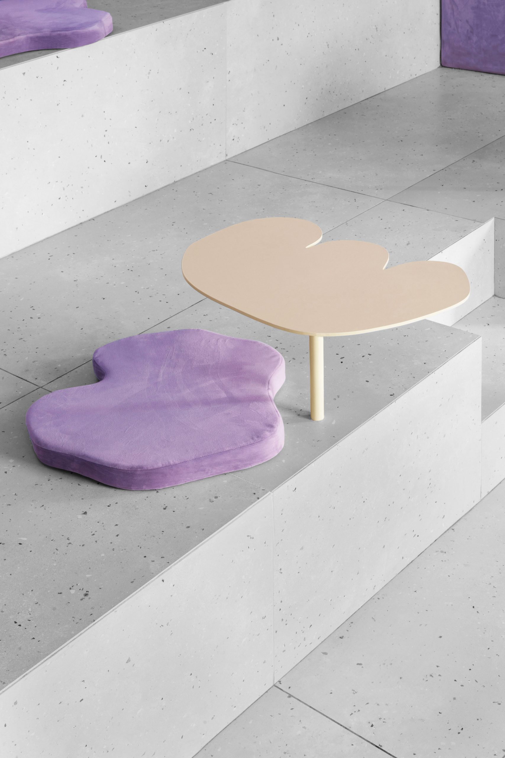 Table and cushion against concrete seat