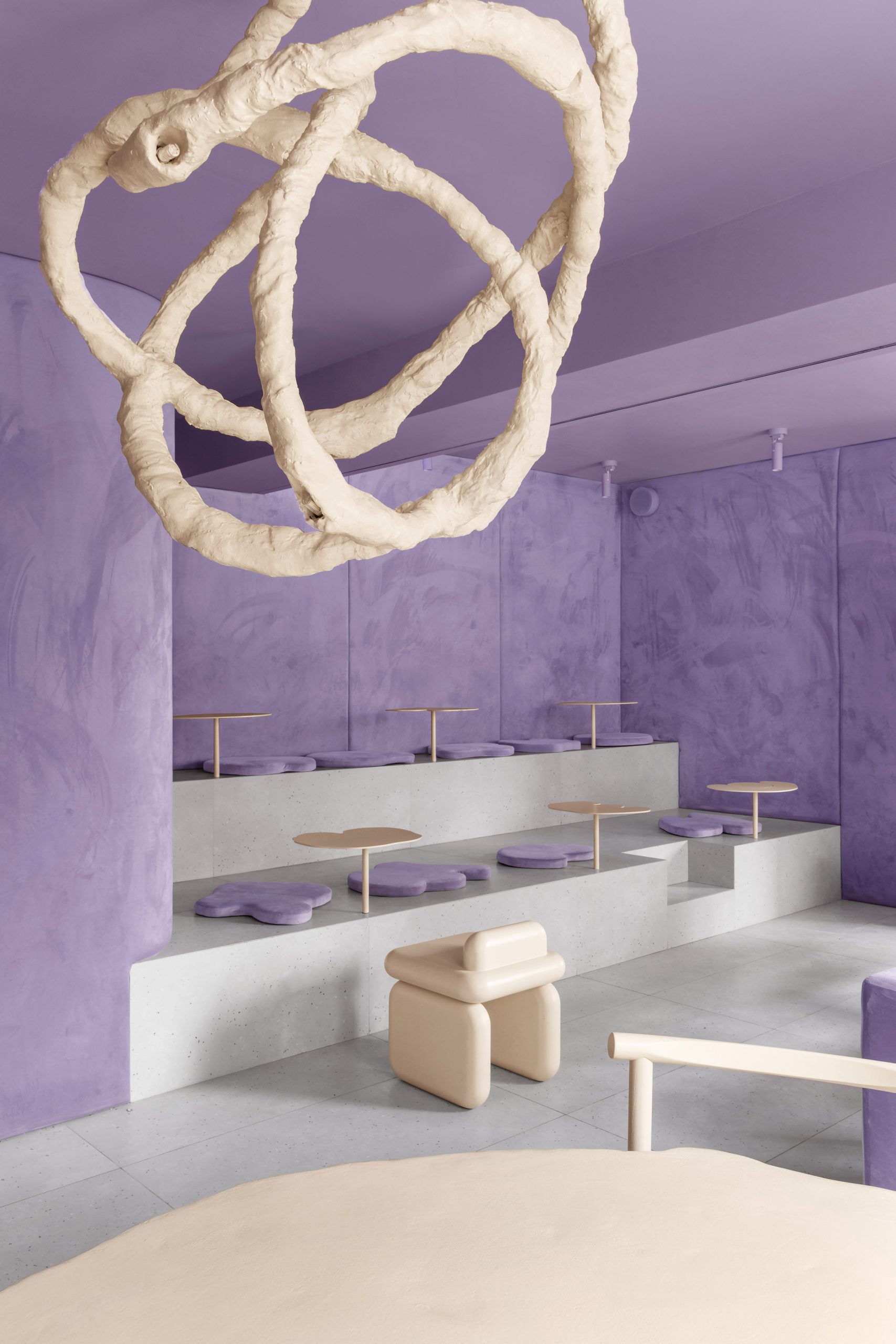 Chandelier and velvet walls in doughnut-themed cafe in Russia