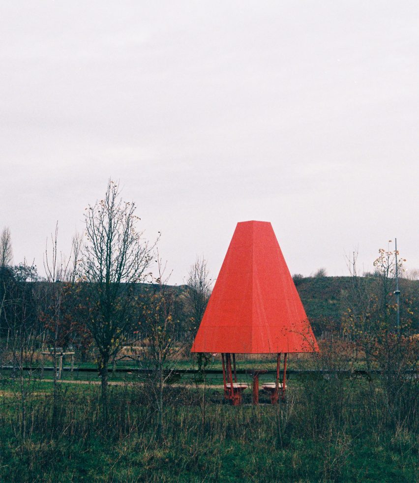 A park with a bright red chess pavilion
