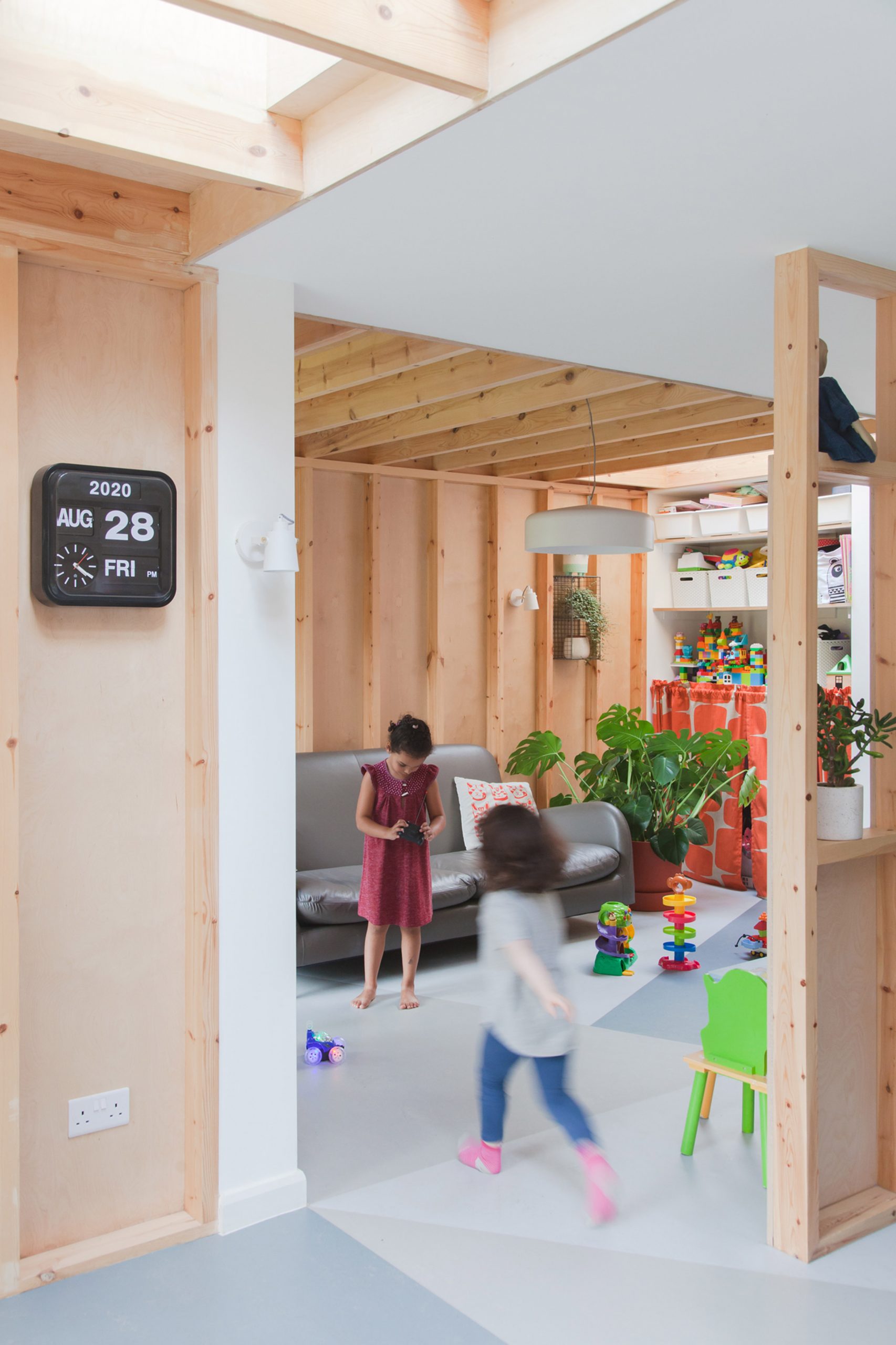 A wood-lined living room and playroom