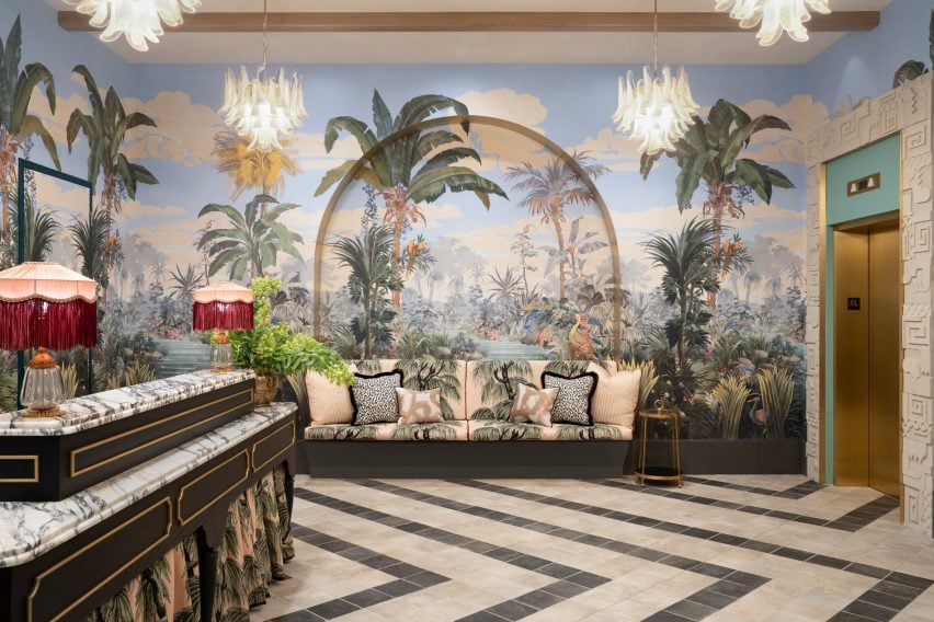 Lobby of the Goodtime Hotel with tropical mural and patterned tiles