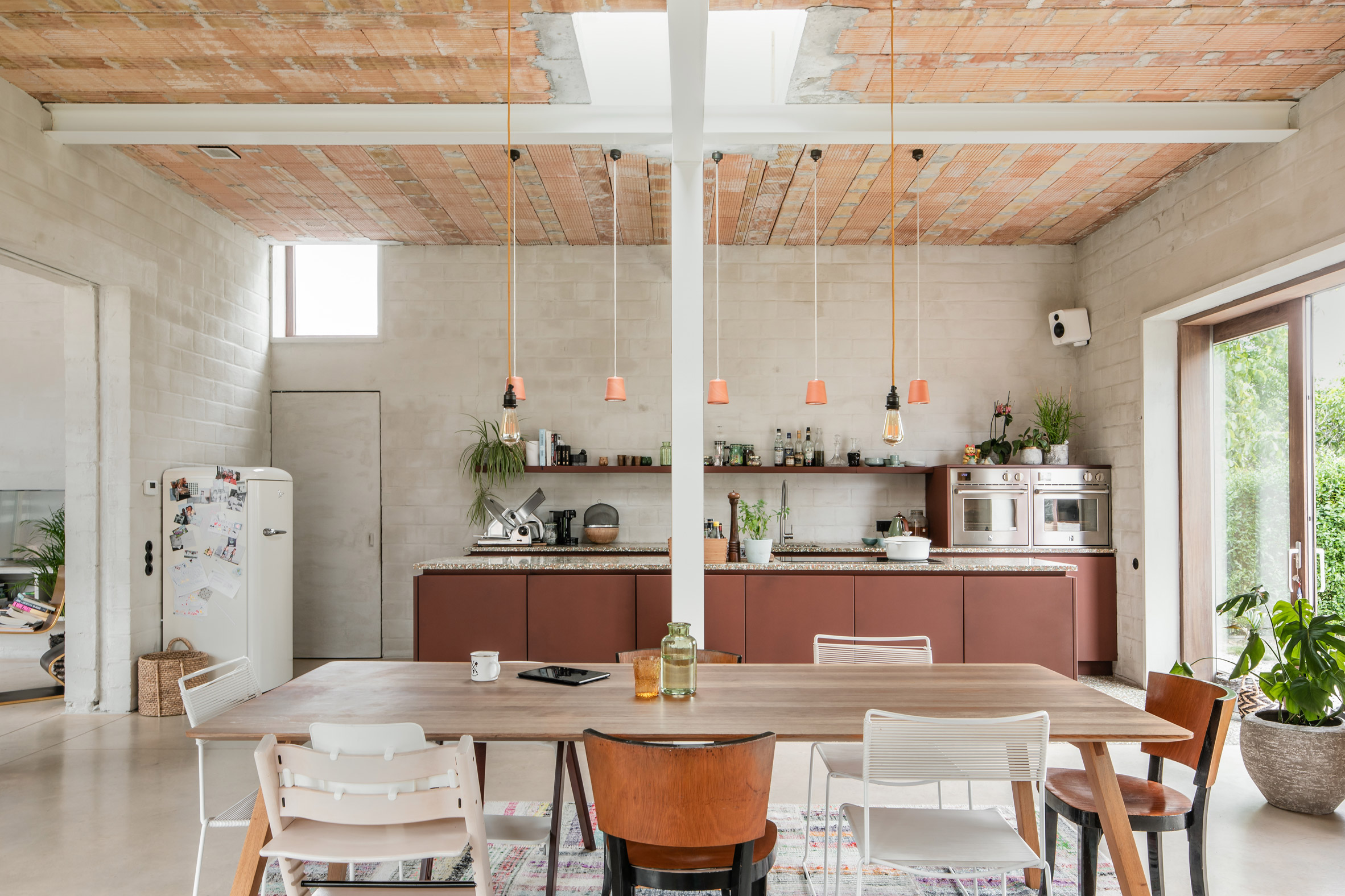 A large kitchen with exposed steel beams