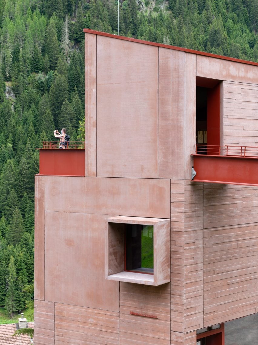 Red concrete exterior of Ibex Museum St Leonhard by Daniela Kröss and Rainer Köberl