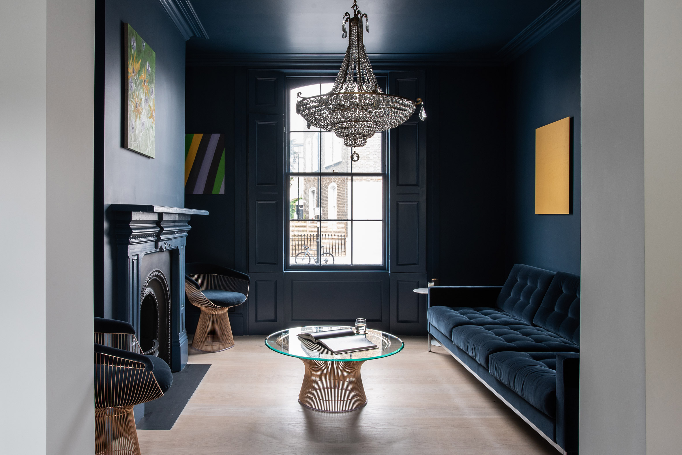A deep blue blankets the sitting room by Moxon Architects