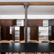 BC—OA hides storage behind metal panels in renovated Soho loft