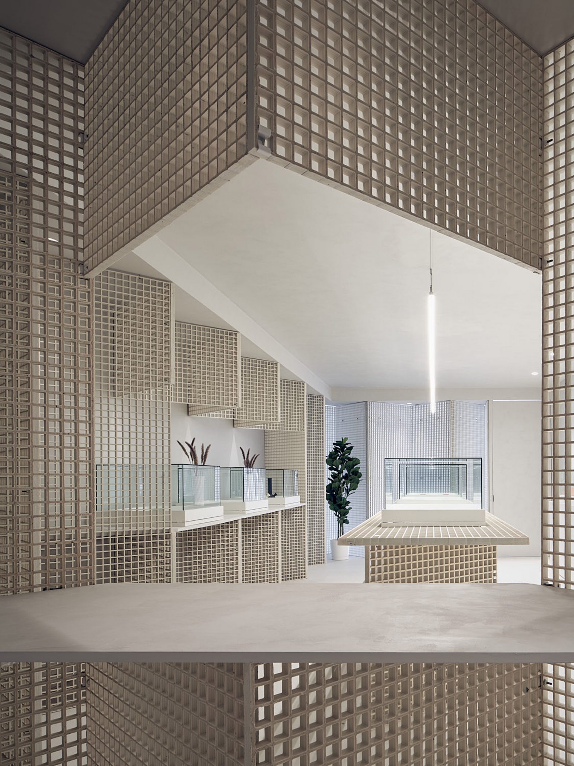 Walls and counter clad in industrial grating by StudioAC