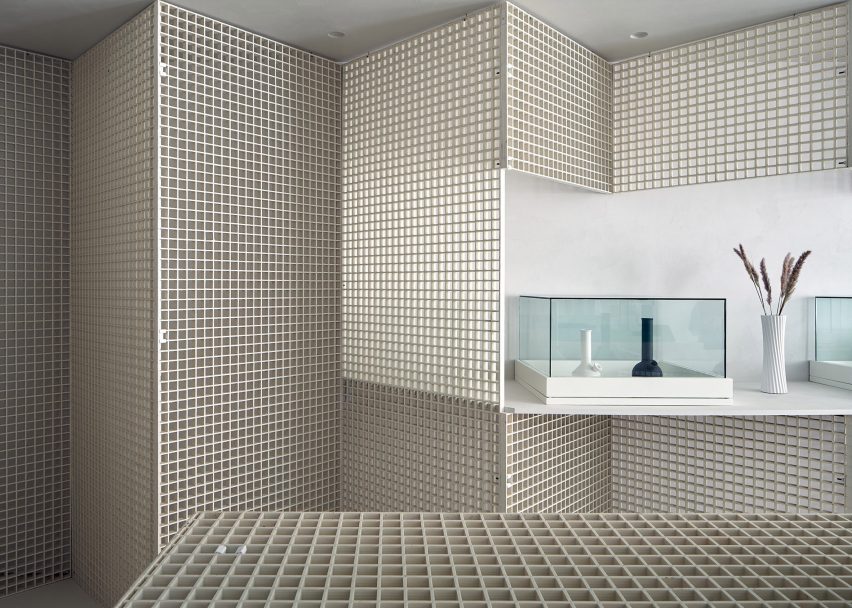 Metal gridded walls and display tables St. Clair West Edition store
