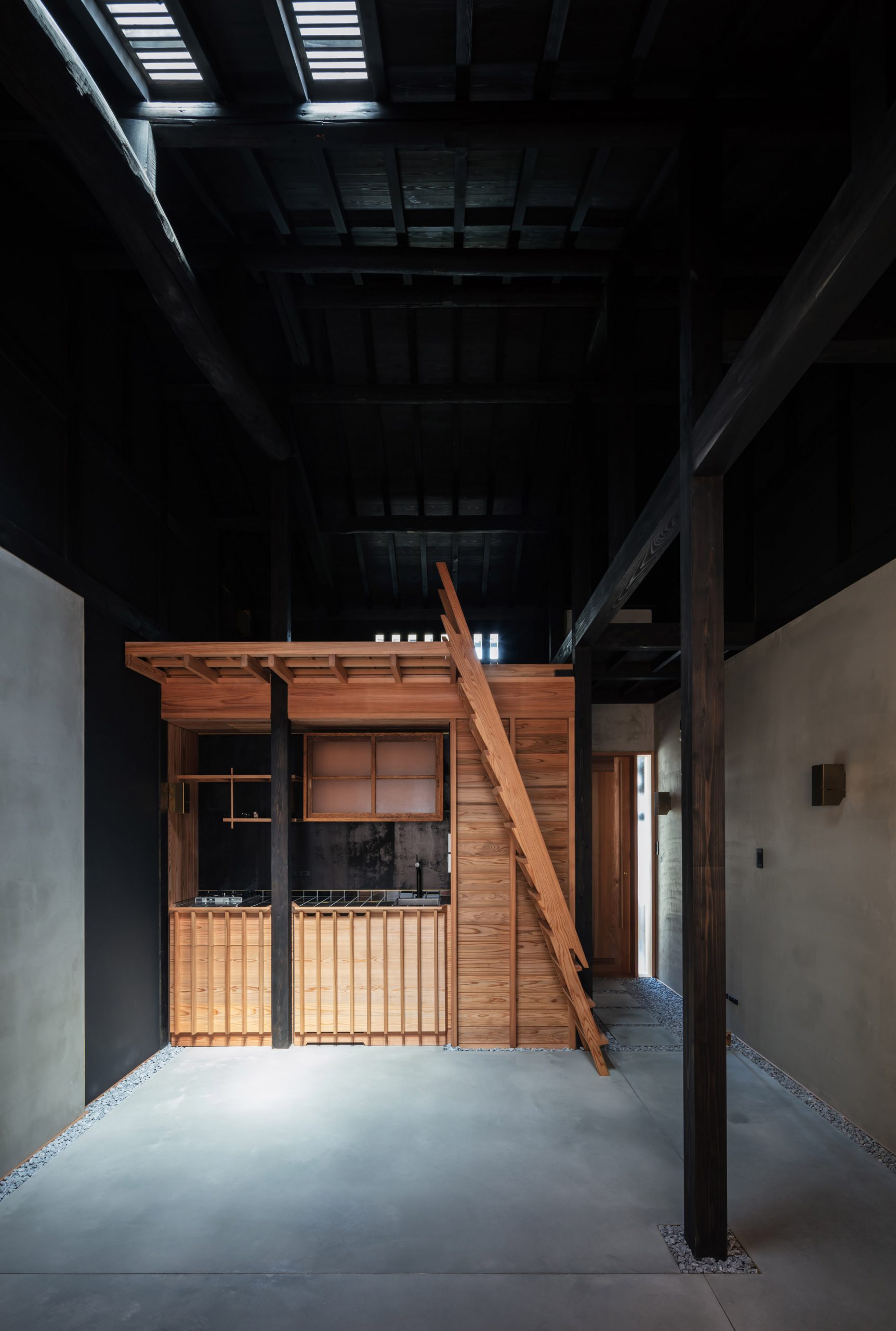 The dark interiors of a narrow Japanese house