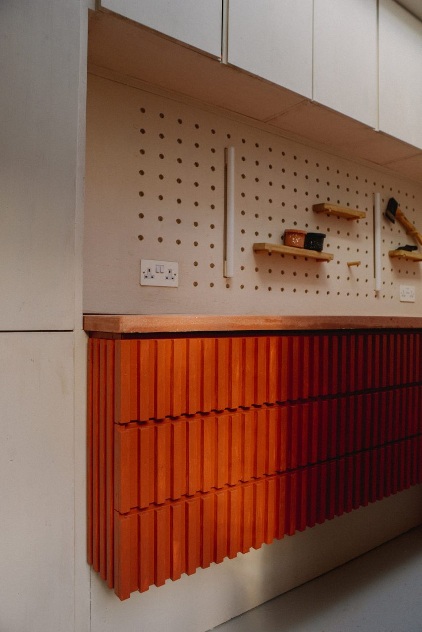 A workshop with a pegboard