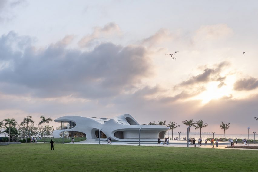 A sinuous pavilion made from white concrete by MAD