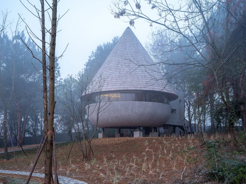 A guesthouse with a conical roof