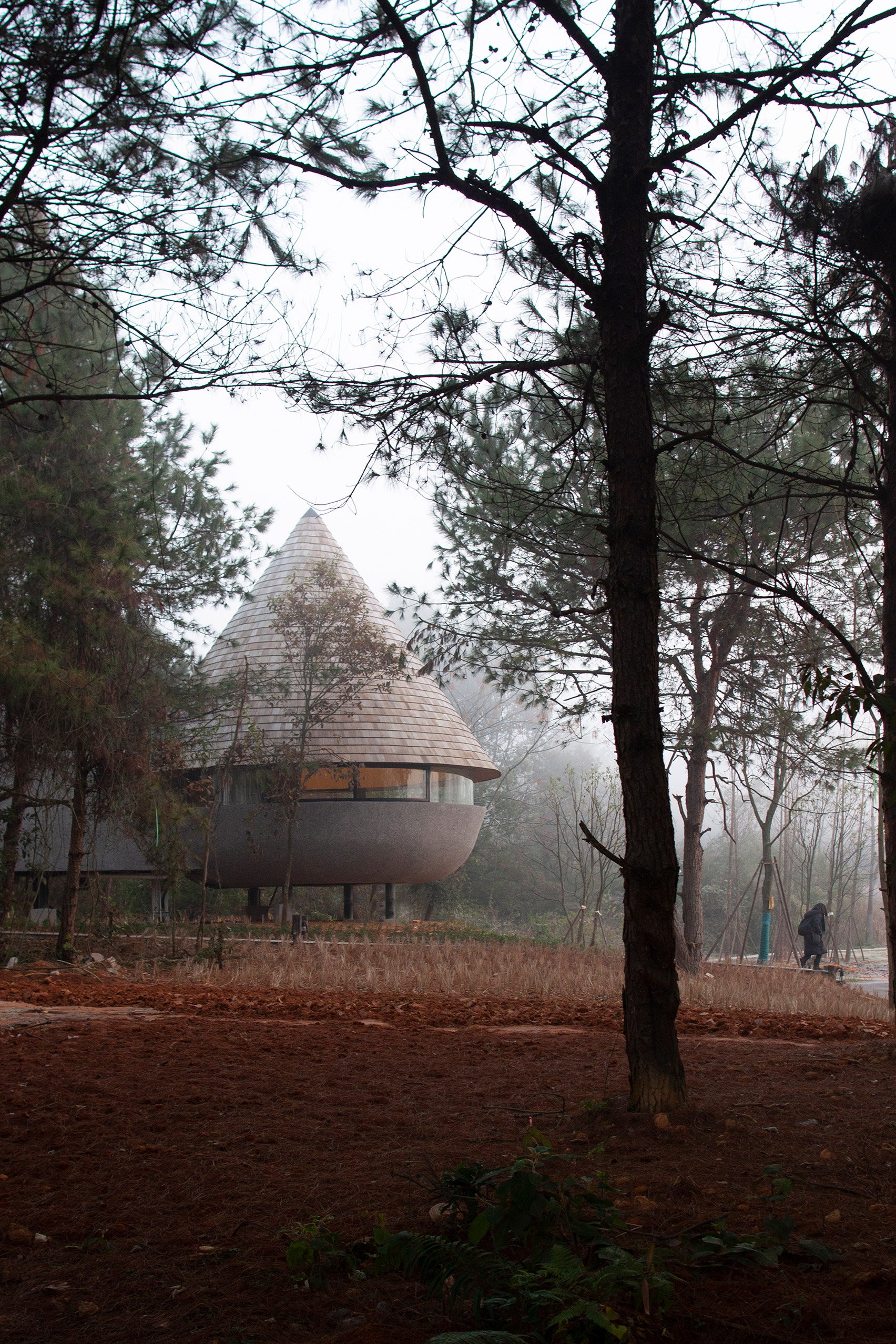 A rural guesthouse with a cone-shaped roof