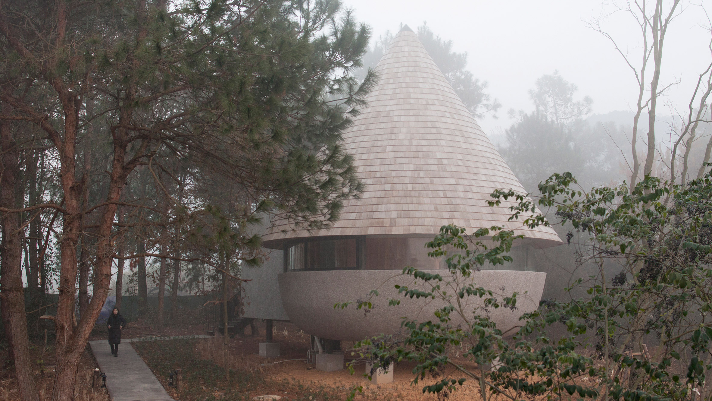 A guesthouse with a conical roof