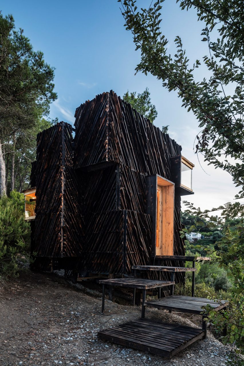 A cabin clad in charred timber