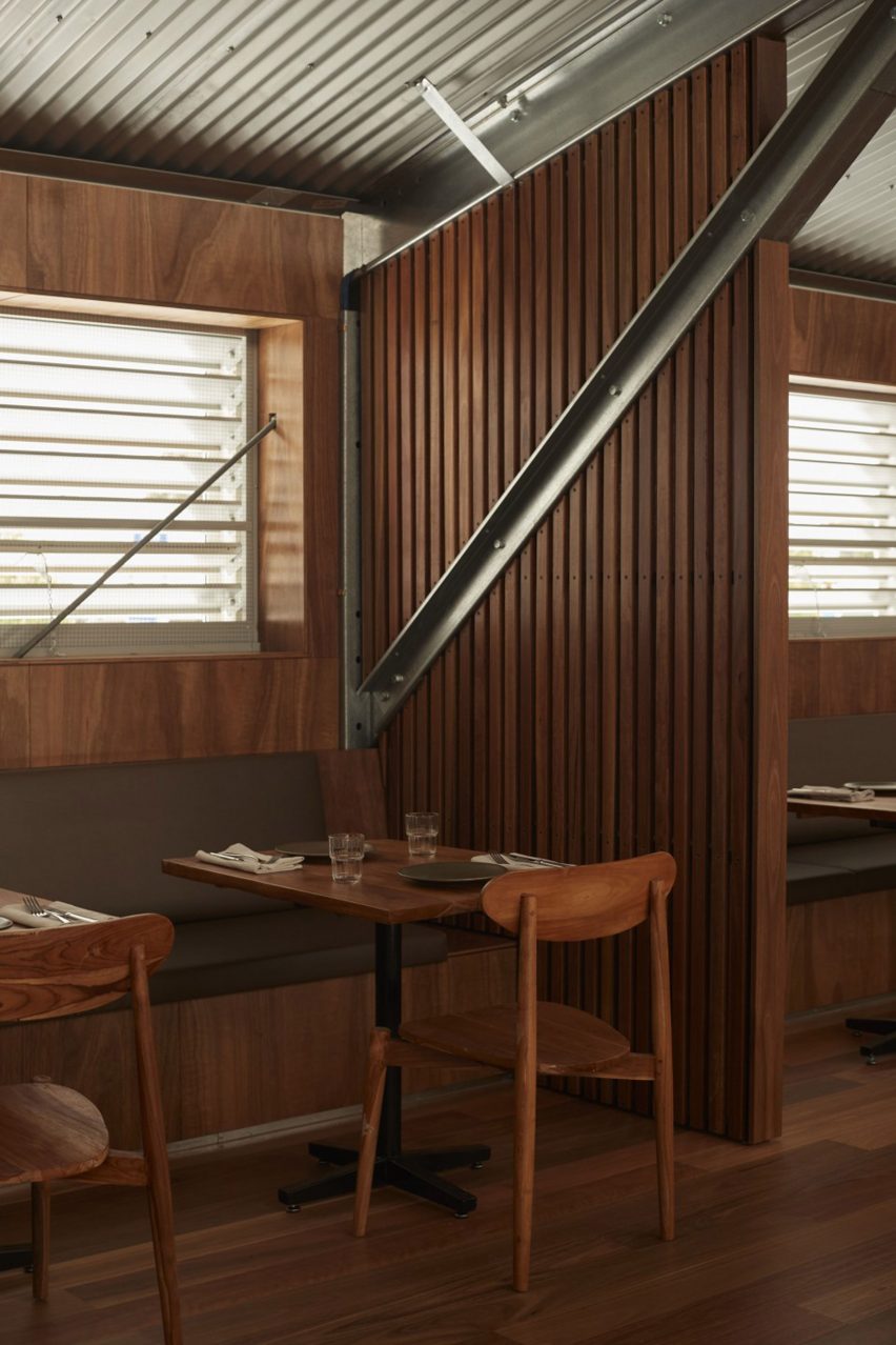 Bench seating and corrugated steel ceiling in Three Blue Ducks restaurant in Melbourne Urbnsurf 