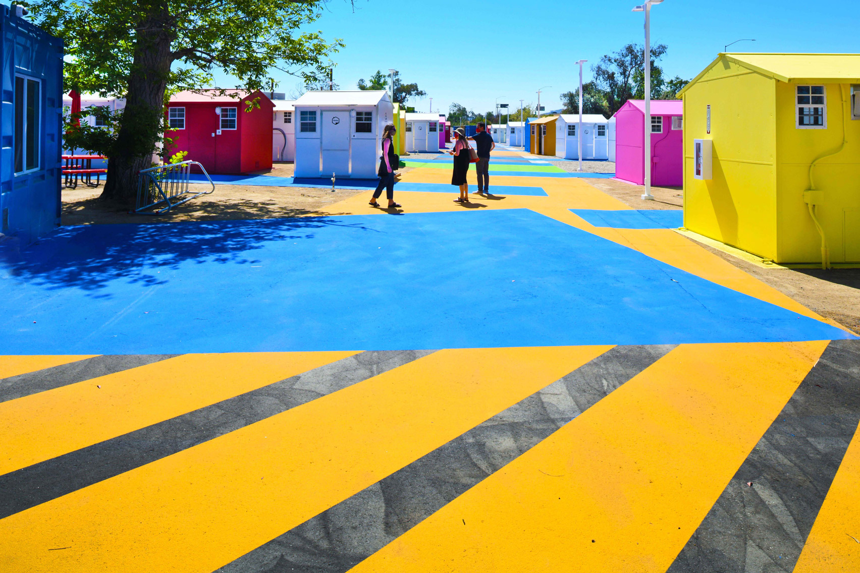 Brightly coloured asphalt in a homeless housing project in LA