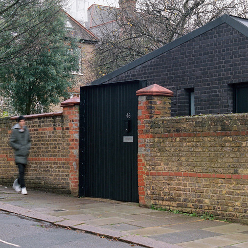 A compact black-brick house features in today's Dezeen Weekly newsletter