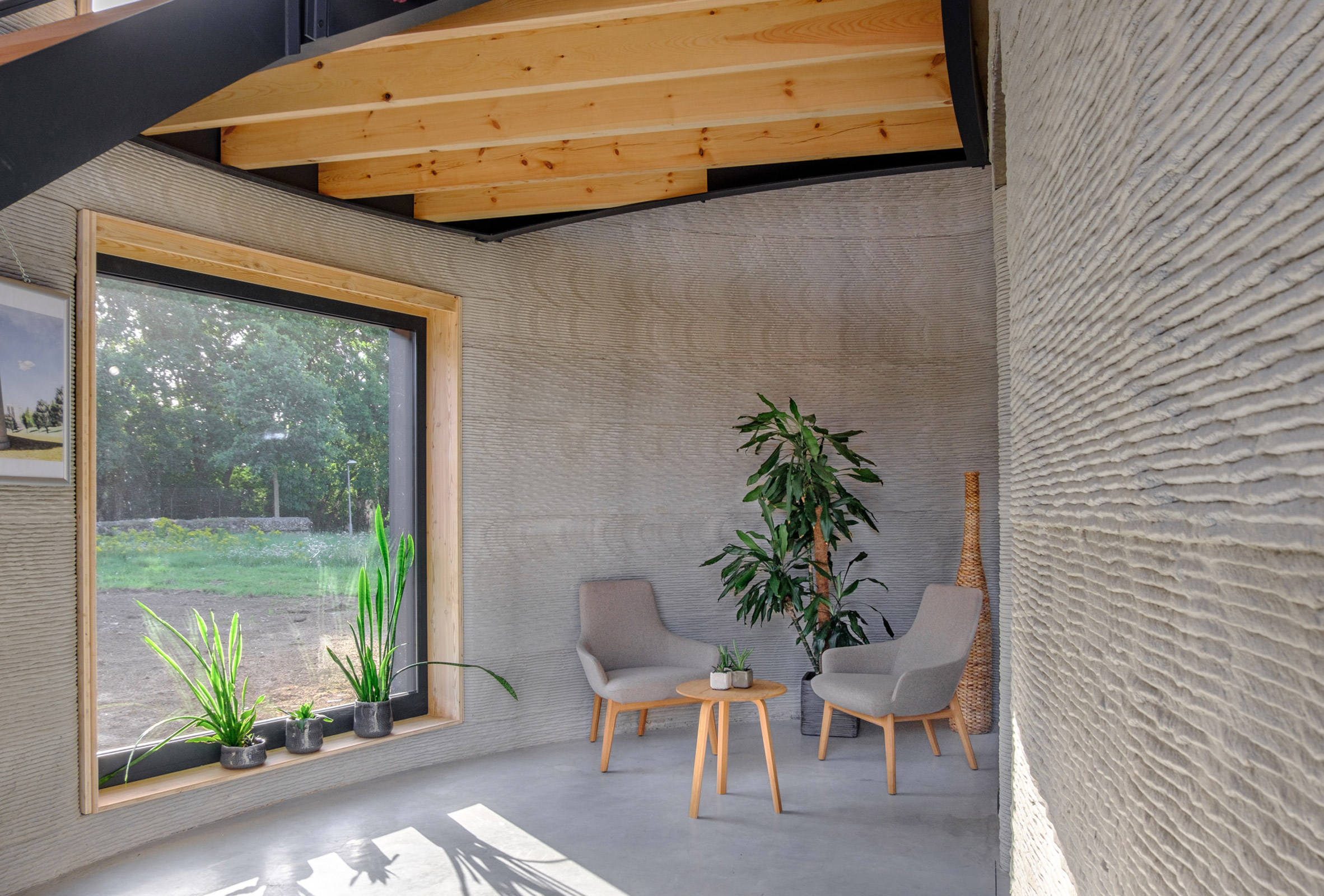 The walls of the 3D-printed home were left exposed