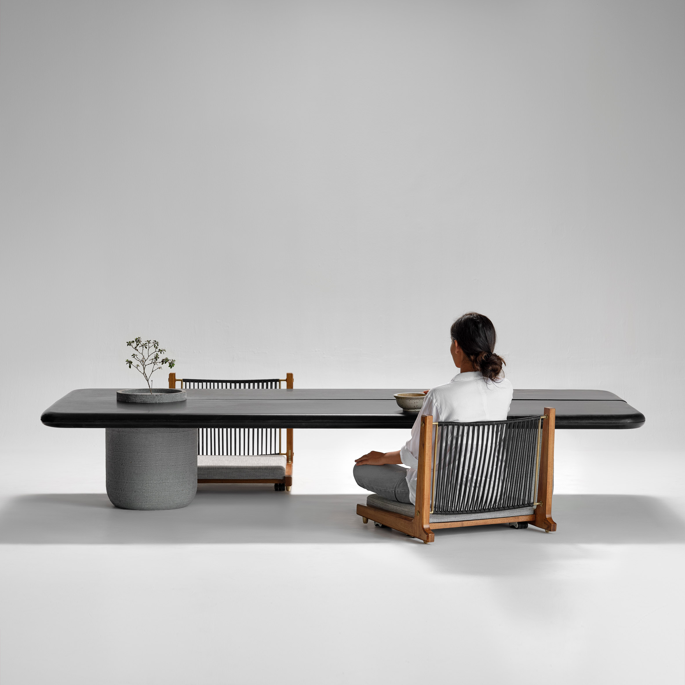 Aayutha low dining table with Kelir chairs by Magari