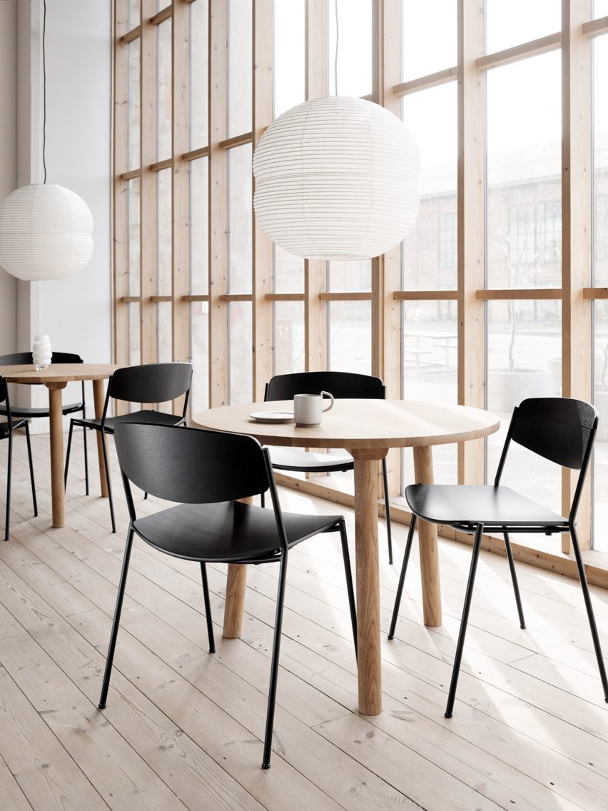 Black chairs at round cafe tables