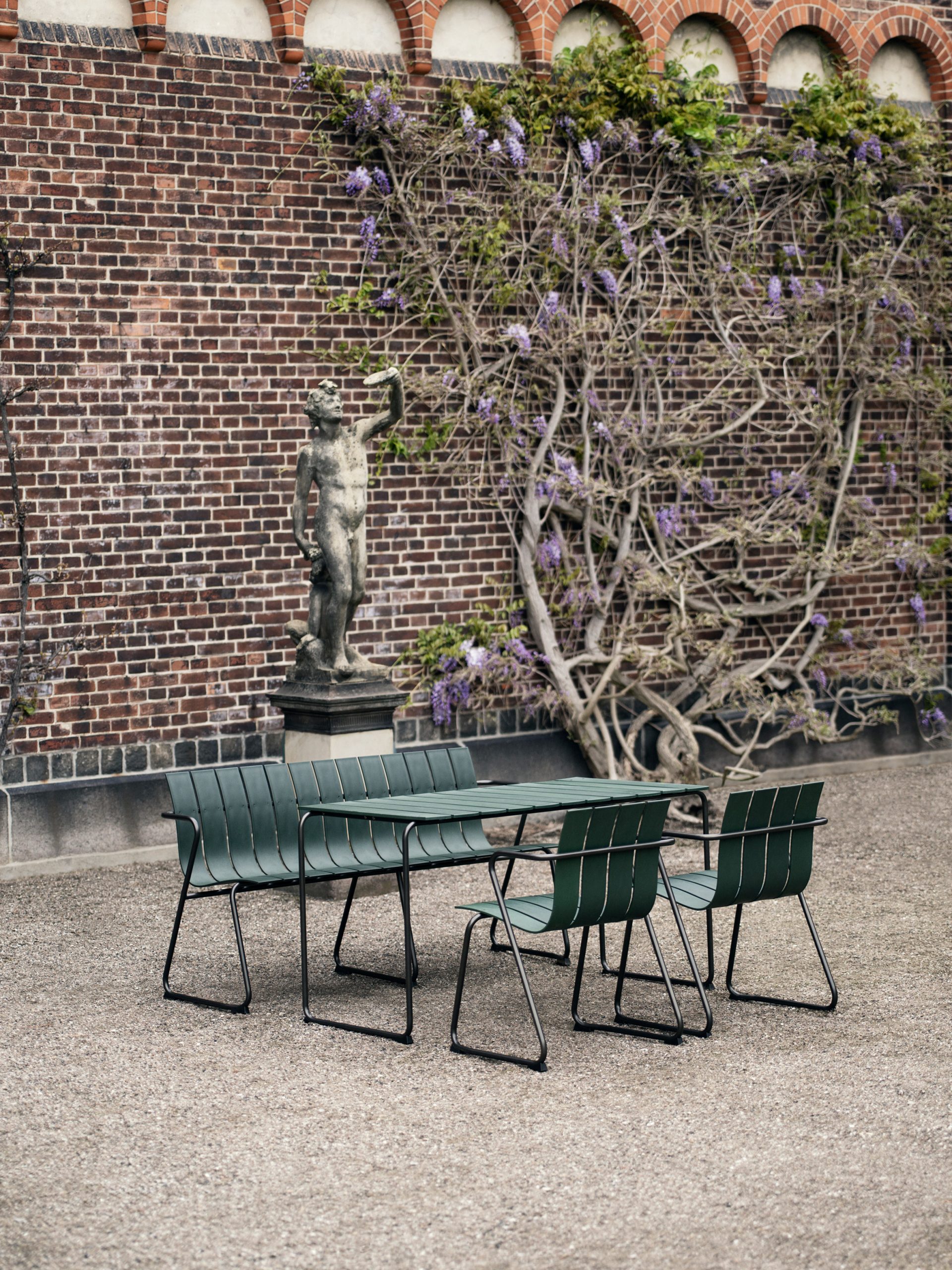 Ocean OC2 outdoor seating in dark green with benches, chairs and tables