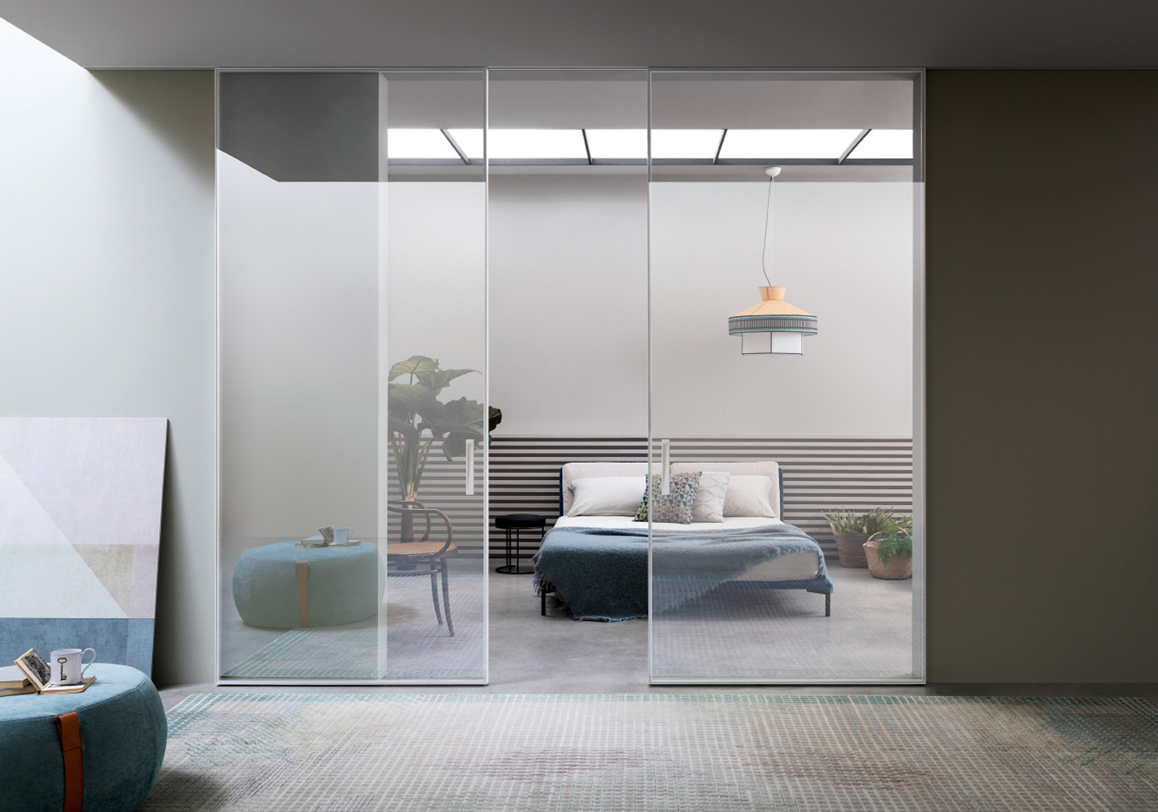 Extraclear glass sliding doors across a bedroom