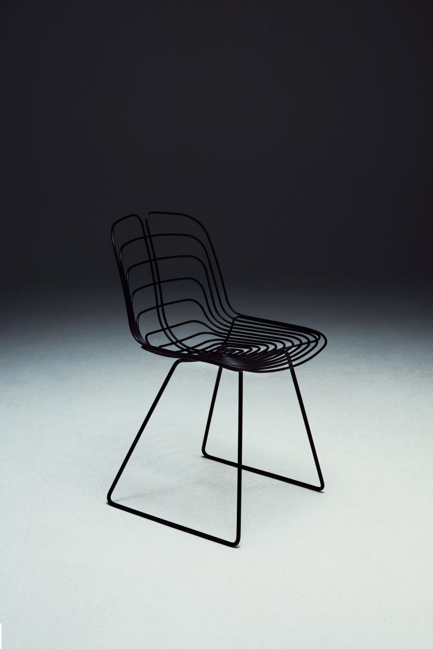 Black chair with sled legs by Michael Young for La Manufacture