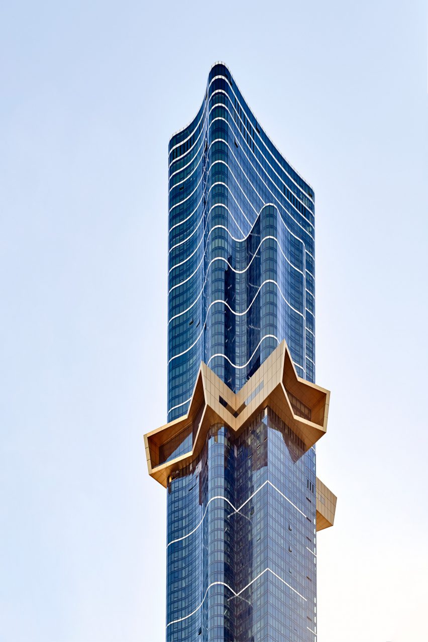 A golden star protruding from a skyscraper