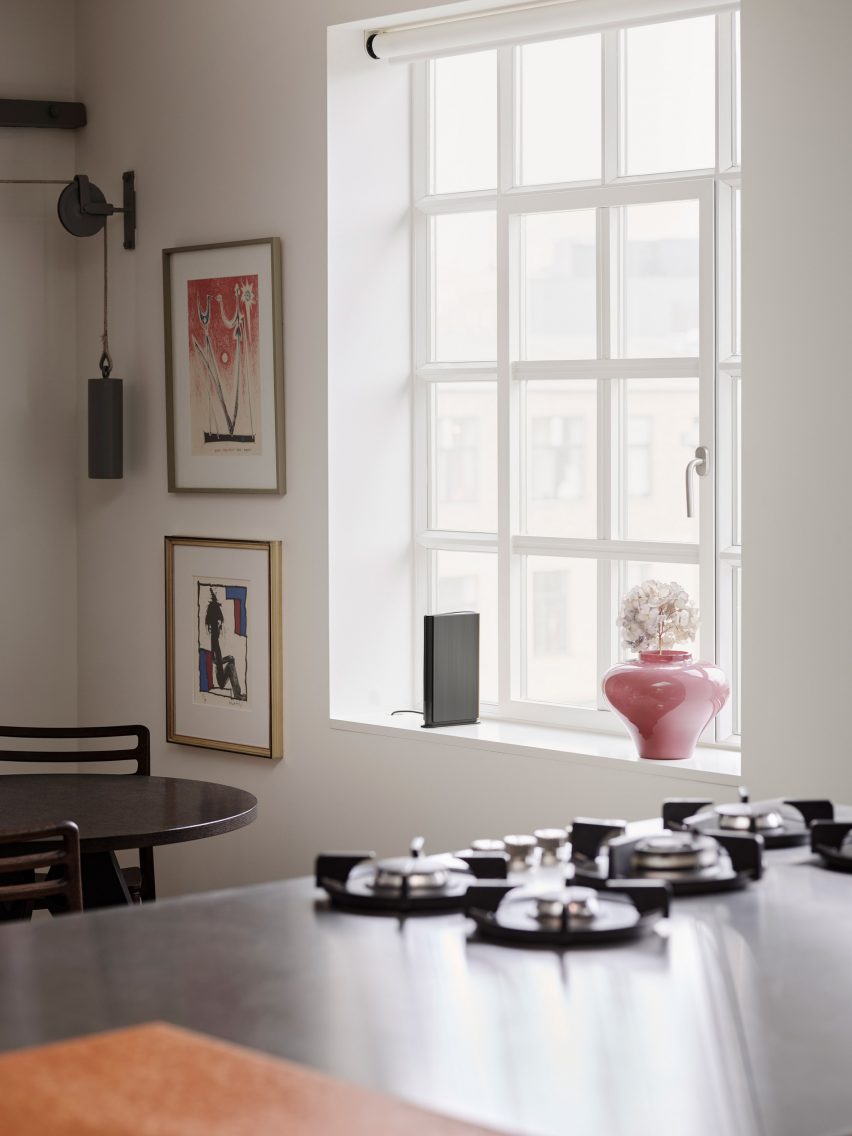 The Beosound Emerge sits on the ledge of a kitchen window
