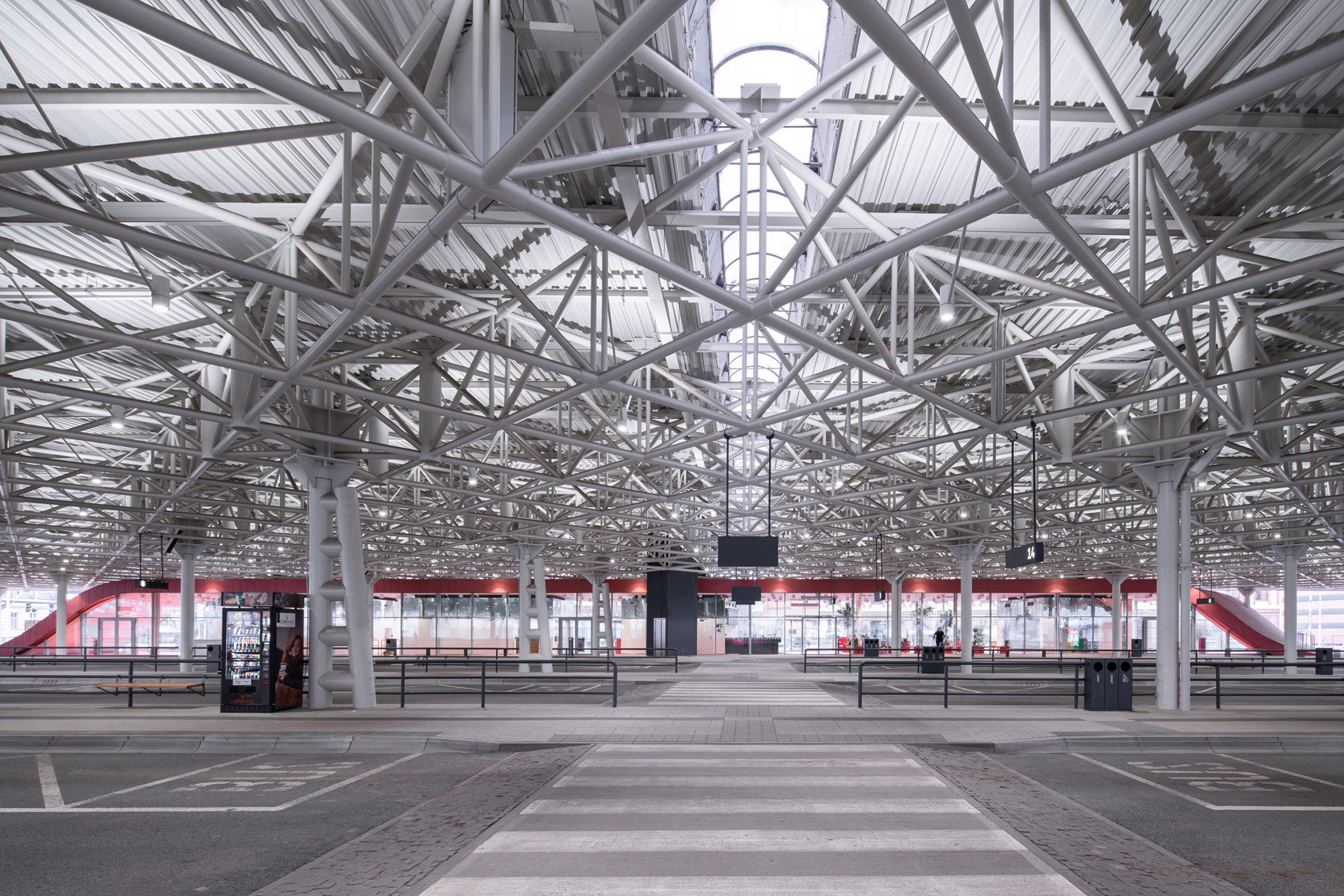 The bus terminal waiting area has a red finish by Chybik + Kristof