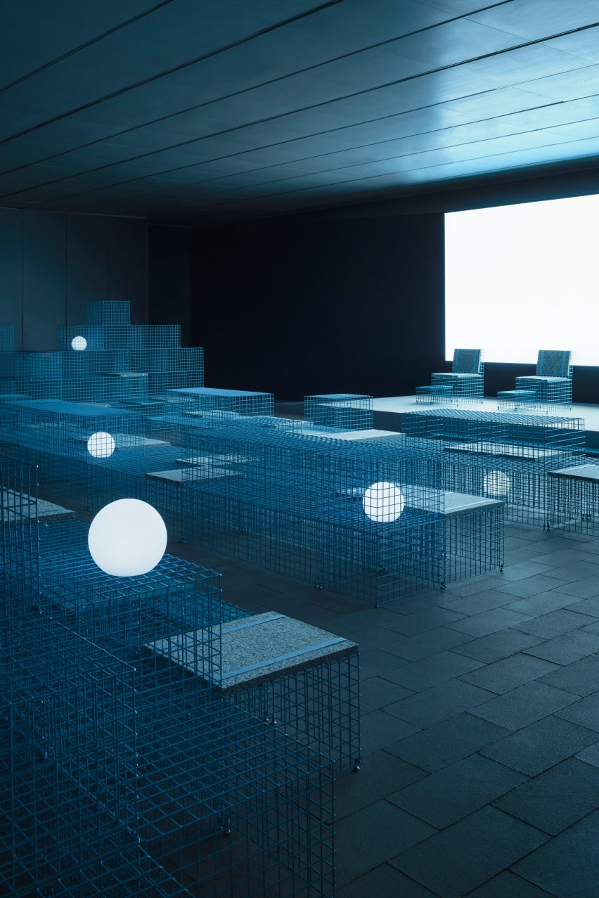 The installation used gridded metal boxes to create seating