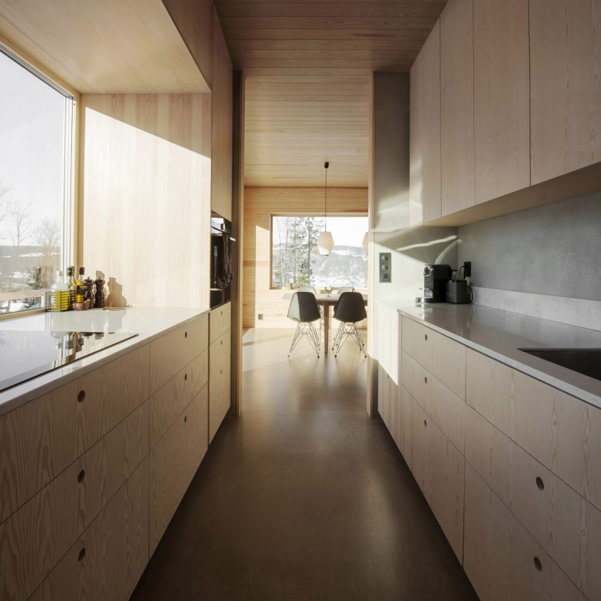 Light wood covers the kitchen