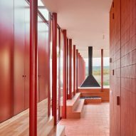 Red living room in House in Sant Antoni de Vilamajor by Arquitectura-G