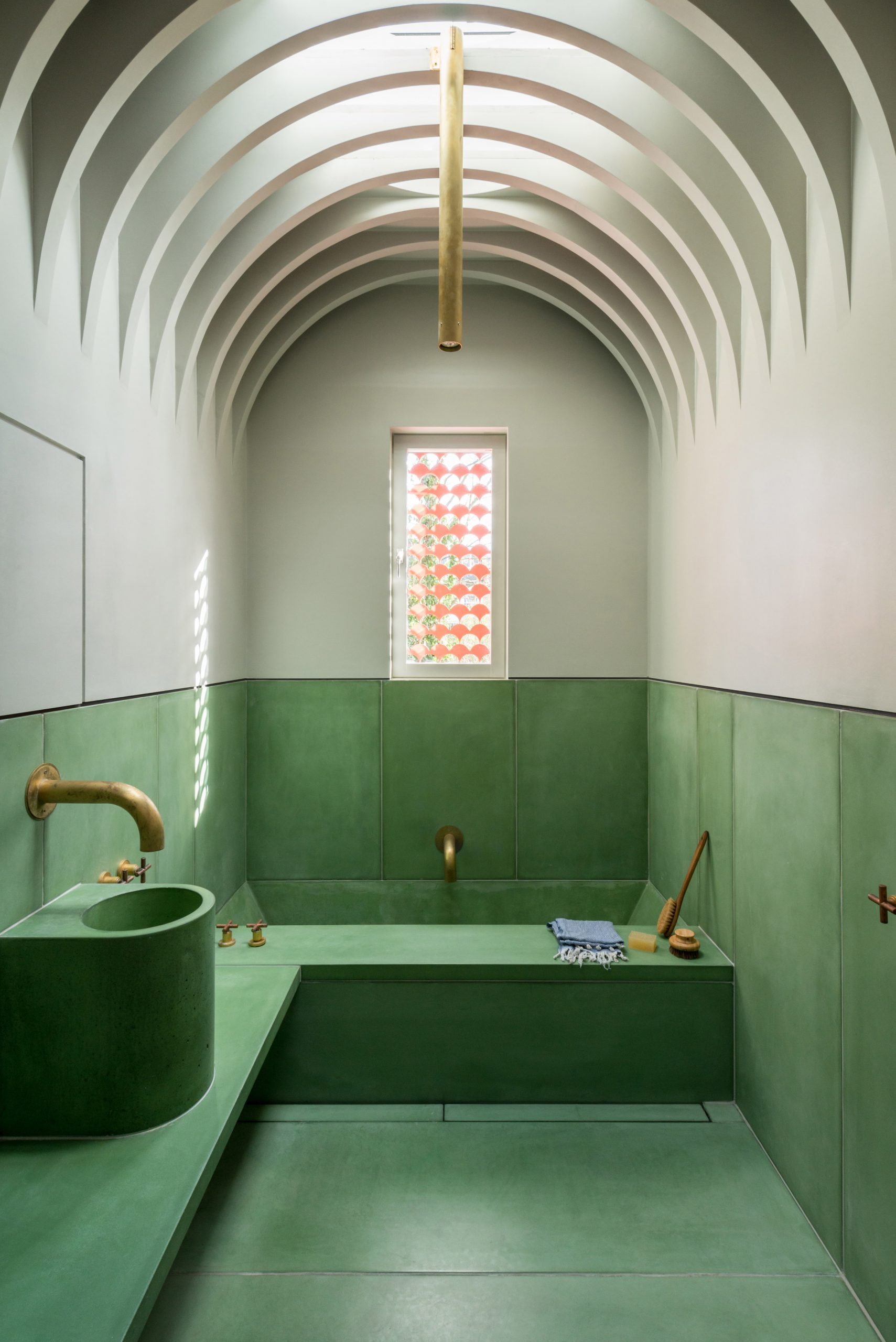 Green bathroom with vaulted ceiling
