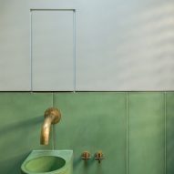 Green tile panels cover the walls