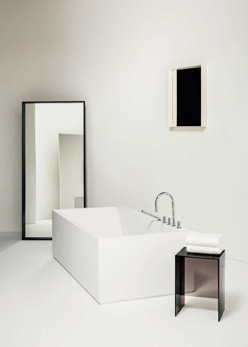 A white bathroom with a freestanding bathtub
