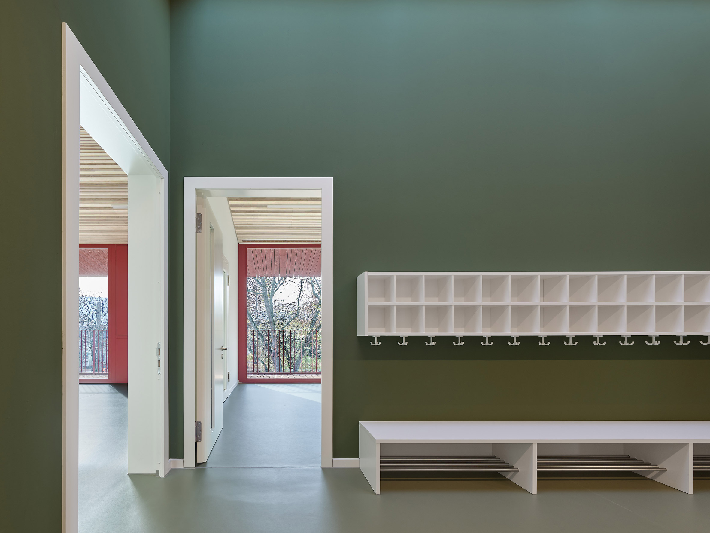 Interior walls at KiTa Parkstrasse by Birk Heilmeyer und Frenzel Architektenhave a green finish