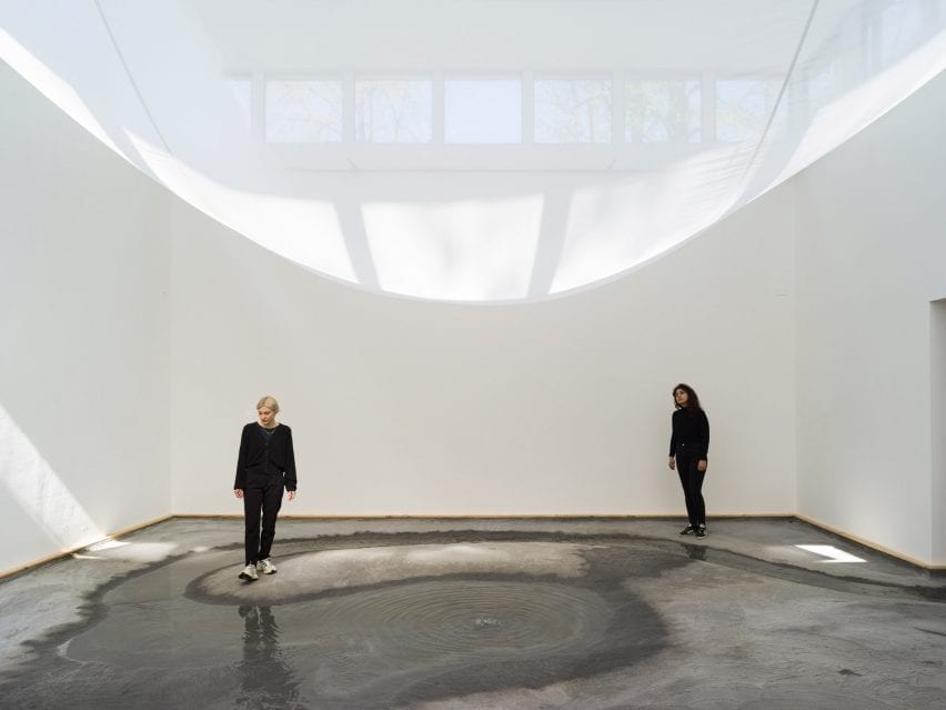 A white sheet is hung across a room at the Danish Pavilion