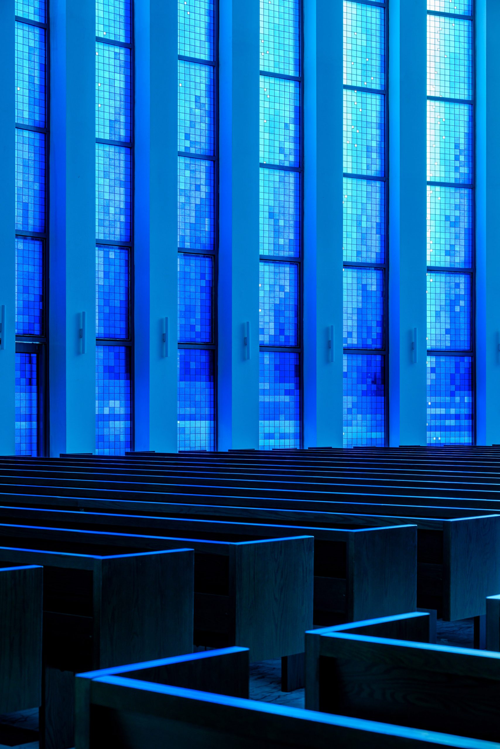 The church's main hall is illuminated by blue light