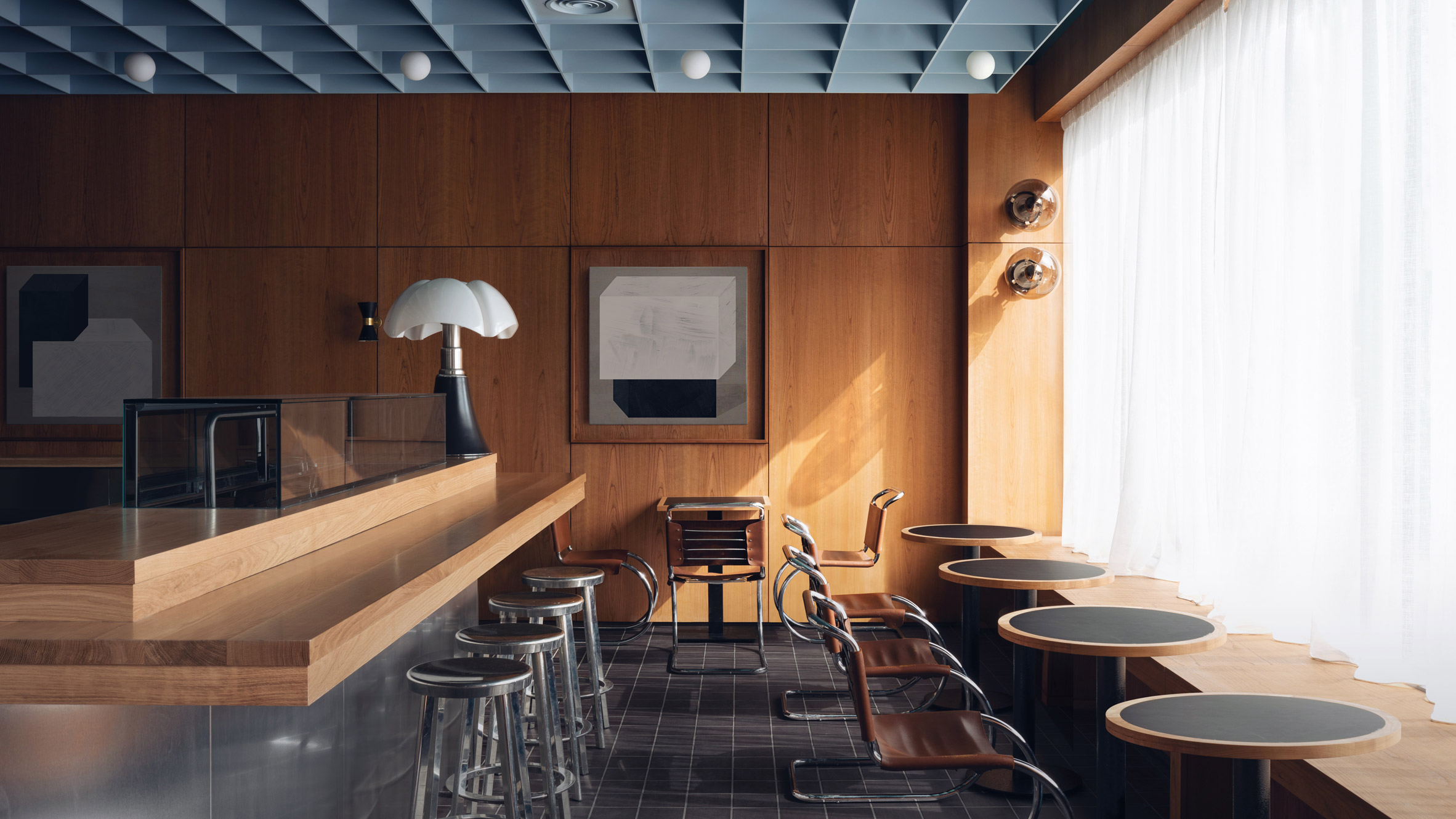 Maido restaurant by Child Studio with cherry wood panelling and soft blue coffered ceiling
