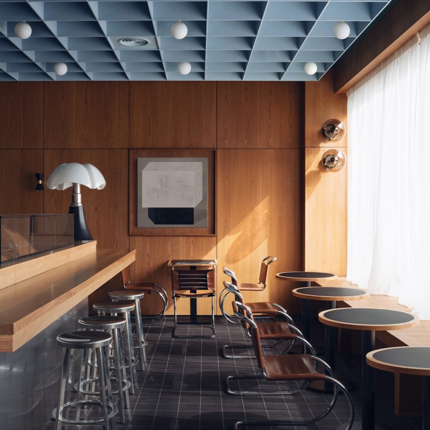 Maido Restaurant by Child Studio with cherry wood paneling and soft blue coffered ceiling