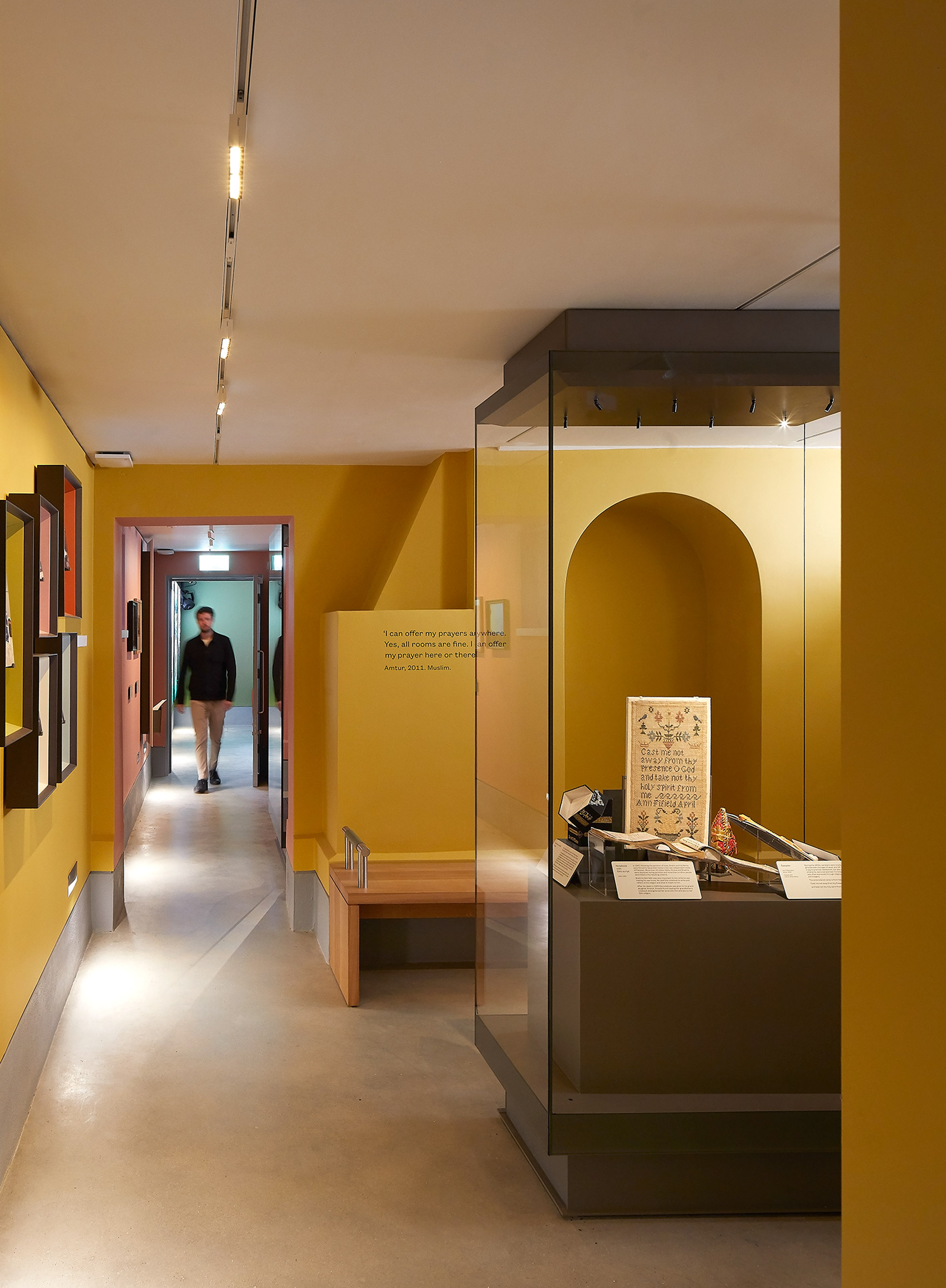 A yellow-walled exhibition space