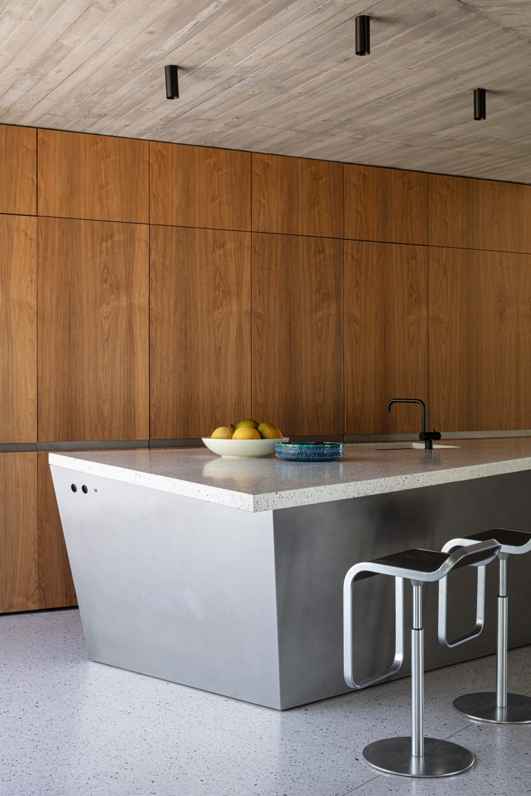 Wood panels line the walls of House Dede's kitchen