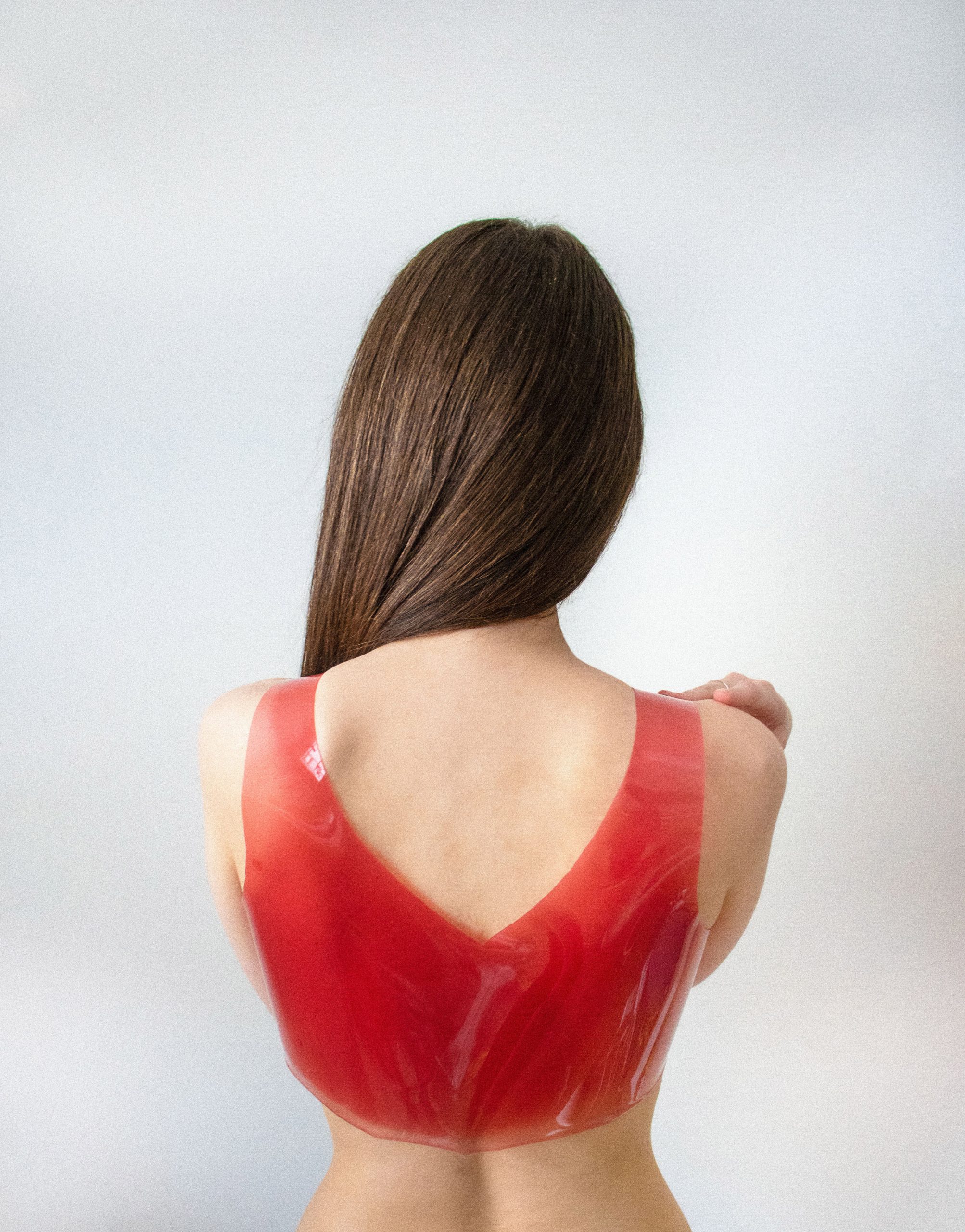 Woman wearing shiny gelatinous top by Valdís Steinarsdóttir